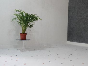 white epoxy terrazzo floor with colorful aggregates and minimal room decor